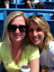 Two girls at a baseball game