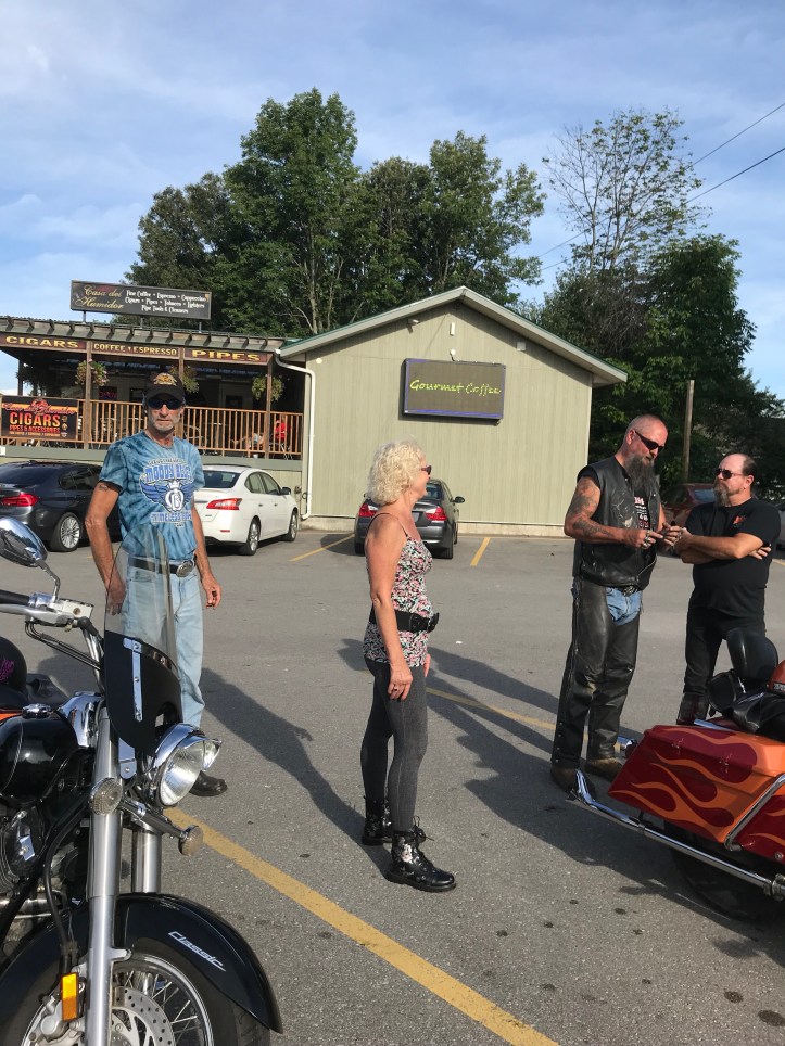 People standing beside motorcycles 