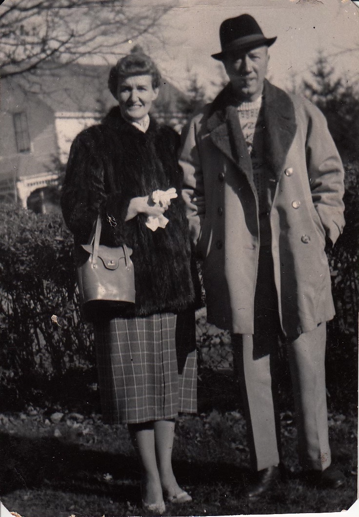 adult brother and sister standing side by side