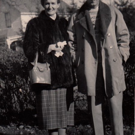 adult brother and sister standing side by side